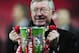 LONDON - MARCH 01: Sir Alex Ferguson manager of Manchester United celebrates with the trophy after victory during the Carling Cup Final match between Manchester United and Tottenham Hotspur at Wembley Stadium on March 1, 2009 in London, England. (Photo