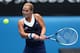 MELBOURNE, AUSTRALIA - JANUARY 20: Dominika Cibulkova of Slovakia plays a backhand in her fourth round match against Maria Sharapova of Russia during day eight of the 2014 Australian Open at Melbourne Park on January 20, 2014 in Melbourne, Australia. (P