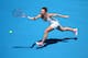MELBOURNE, AUSTRALIA - JANUARY 20: Simona Halep of Romania plays a forehand in her fourth round match against Jelena Jankovic of Serbia during day eight of the 2014 Australian Open at Melbourne Park on January 20, 2014 in Melbourne, Australia. (Photo by
