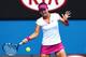 MELBOURNE, AUSTRALIA - JANUARY 21: Na Li of China plays a forehand in her quarterfinal match against Flavia Pennetta of Italy during day nine of the 2014 Australian Open at Melbourne Park on January 21, 2014 in Melbourne, Australia. (Photo by Renee McKa