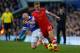 LIVERPOOL, ENGLAND - DECEMBER 29: Luke Shaw of Southampton is tackled by Steven Naismith of Everton during the Barclays Premier League match between Everton and Southampton at Goodison Park on December 29, 2013 in Liverpool, England. (Photo by Paul Thom