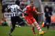 NEWCASTLE UPON TYNE, ENGLAND - DECEMBER 14: Cheick Tiote of Newcastle United tackles Luke Shaw of Southampton during the Barclays Premier League match between Newcastle United and Southampton at St James' Park on December 14, 2013 in Newcastle upon Tyne,