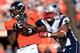 DENVER, CO - JANUARY 19: Julius Thomas #80 of the Denver Broncos runs with the ball against Dont'a Hightower #54 of the New England Patriots during the AFC Championship game at Sports Authority Field at Mile High on January 19, 2014 in Denver, Colorado.