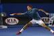 MELBOURNE, AUSTRALIA - JANUARY 20: Roger Federer of Switzerland stretches to play a forehand in his fourth round match against Jo-Wilfried Tsonga of France during day eight of the 2014 Australian Open at Melbourne Park on January 20, 2014 in Melbourne, A