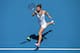 MELBOURNE, AUSTRALIA - JANUARY 20: Simona Halep of Romaniaplays a forehand in her fourth round match against Jelena Jankovic of Serbia during day eight of the 2014 Australian Open at Melbourne Park on January 20, 2014 in Melbourne, Australia. (Photo by