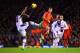 LIVERPOOL, ENGLAND - JANUARY 18: Philippe Coutinho of Liverpool challenges for the ball with Leandro Bacuna of Aston Villa during the Barclays Premier League match between Liverpool and Aston Villa at Anfield on January 18, 2014 in Liverpool, England. (P