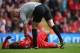 LIVERPOOL, ENGLAND - OCTOBER 05: Daniel Sturridge of Liverpool lies injured and is checked by the referee Mr A Taylor during the Barclays Premier League match between Liverpool and Crystal Palace at Anfield on October 5, 2013 in Liverpool, England. (Pho