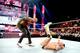 Batista sends Alberto Del Rio crashing to the mat.