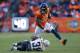 DENVER, CO - JANUARY 12: Demaryius Thomas #88 of the Denver Broncos tries to avoid the tackle of Richard Marshall #31 of the San Diego Chargers during the AFC Divisional Playoff Game at Sports Authority Field at Mile High on January 12, 2014 in Denver,