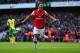 LONDON, ENGLAND - OCTOBER 19: Mesut Oezil of Arsenal celebrates as he scores their second goal during the Barclays Premier League match between Arsenal and Norwich City at Emirates Stadium on October 19, 2013 in London, England. (Photo by Paul Gilham/Ge