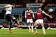 LONDON, ENGLAND - JANUARY 21: Alvaro Negredo of Manchester City (L) beats James Tomkins of West Ham United (R) to score their first goal during the Capital One Cup Semi-Final, Second Leg match between West Ham United and Manchester City at Boleyn Ground