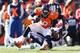 DENVER, CO - JANUARY 19: Julius Thomas #80 of the Denver Broncos is tackled by Chris Jones #94 of the New England Patriots in the first quarter during the AFC Championship game at Sports Authority Field at Mile High on January 19, 2014 in Denver, Colora