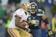 Jan 19, 2014; Seattle, WA, USA; San Francisco 49ers running back Frank Gore (21) runs the ball against Seattle Seahawks defensive end Red Bryant (79) during the first half of the 2013 NFC Championship football game at CenturyLink Field. Mandatory Credit: