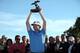 LA JOLLA, CA - JANUARY 29: Brandt Snedeker poses with the winner's trophy after his -16 under 2 hole playoff victory during the final round of the Farmers Insurance Open at Torrey Pines Golf Course, South Course on January 29, 2012 in La Jolla, Californi