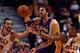 CHICAGO, IL - JANUARY 20: Pau Gasol #16 of the Los Angeles Lakers passes the ball under pressure from Joakim Noah #13 (L) and Jimmy Butler #21 of the Chicago Bulls at the United Center on January 20, 2014 in Chicago, Illinois. NOTE TO USER: User expressly