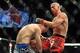 Nov 16, 2013; Las Vegas, NV, USA; Donald Cerrone (red gloves) fights against Evan Dunham (blue gloves) in their lightweight bout during UFC 167 at MGM Grand Garden Arena. Mandatory Credit: Stephen R. Sylvanie-USA TODAY Sports
