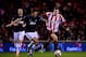 SUNDERLAND, ENGLAND - JANUARY 07: Michael Carrick of Manchester United and Adam Johnson of Sunderland battle for the ball during the Capital One Cup Semi-Final, first leg match between Sunderland and Manchester United at Stadium of Light on January 7, 20