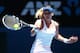 MELBOURNE, AUSTRALIA - JANUARY 22: Agnieszka Radwanska of Poland plays a forehand in her quarterfinal match against Victoria Azarenka of Belarus during day 10 of the 2014 Australian Open at Melbourne Park on January 22, 2014 in Melbourne, Australia. (Ph