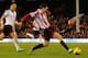 LONDON, ENGLAND - JANUARY 11: Adam Johnson of Sunderland scores his sides third goal during the Barclays Premier League match between Fulham and Sunderland at Craven Cottage on January 11, 2014 in London, England. (Photo by Clive Rose/Getty Images)