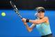 MELBOURNE, AUSTRALIA - JANUARY 19: Eugenie Bouchard of Canada plays a backhand in her fourth round singles match against Casey Dellacqua of Australia during day seven of the 2014 Australian Open at Melbourne Park on January 19, 2014 in Melbourne, Austral