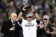 Jan 19, 2014; Seattle, WA, USA; Seattle Seahawks quarterback Russell Wilson hoists the George Halas Trophy after the 2013 NFC Championship football game against the San Francisco 49ers at CenturyLink Field. Mandatory Credit: Joe Nicholson-USA TODAY Sports