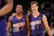 DENVER, CO - December 20: Eric Bledsoe #2 and Goran Dragic #1 of the Phoenix Suns smile and walk off the court against the Denver Nuggets on December 20, 2013 at the Pepsi Center in Denver, Colorado. NOTE TO USER: User expressly acknowledges and agrees t