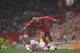 Stan Collymore in action for Liverpool against Manchester United.