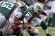 Oct 28, 2012; East Rutherford, NJ, USA; Miami Dolphins defensive end Cameron Wake (91) sacks New York Jets quarterback Mark Sanchez (6) during the first half at MetLIfe Stadium. Mandatory Credit: Ed Mulholland-USA TODAY Sports