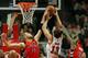 CHICAGO, IL - DECEMBER 14: Jonas Valanciunas #17 of the Toronto Raptors blocks a shot by Joakim Noah #13 of the Chicago Bulls as Amir Johnson #15 defends at the United Center on December 14, 2013 in Chicago, Illinois. NOTE TO USER: User expressly acknowl