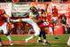 LINCOLN, NE - NOVEMBER 29: Quarterback Ron Kellogg III #12 of the Nebraska Cornhuskers takes a hit from linebacker Christian Kirksey #20 of the Iowa Hawkeyes during their game at Memorial stadium on November 29, 2013 in Lincoln, Nebraska. (Photo by Eric F