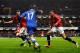 LONDON, ENGLAND - JANUARY 19: Eden Hazard of Chelsea is challenged by Phil Jones (L) and Chris Smalling (R) of Manchester United during the Barclays Premier League match between Chelsea and Manchester United at Stamford Bridge on January 19, 2014 in Lond