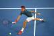 MELBOURNE, AUSTRALIA - JANUARY 22: Roger Federer of Switzerland plays a forehand in his quarterfinal match against Andy Murray of Great Britain during day 10 of the 2014 Australian Open at Melbourne Park on January 22, 2014 in Melbourne, Australia. (Pho