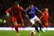 LIVERPOOL, ENGLAND - JANUARY 05: Korey Smith of Oldham takes on Lucas of Liverpool during the Budweiser FA Cup third round match between Liverpool and Oldham Athletic at Anfield on January 5, 2014 in Liverpool, England. (Photo by Clive Mason/Getty Images