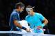 LONDON, ENGLAND - NOVEMBER 10: Rafael Nadal of Spain and Roger Federer of Switzerland changeover during their men's singles semi-final match on day seven of the Barclays ATP World Tour Finals at O2 Arena on November 10, 2013 in London, England. (Photo b