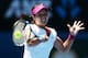 MELBOURNE, AUSTRALIA - JANUARY 23: Na Li of China plays a forehand in her semifinal match against Eugenie Bouchard of Canada during day 11 of the 2014 Australian Open at Melbourne Park on January 23, 2014 in Melbourne, Australia. (Photo by Clive Brunski
