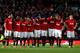 MANCHESTER, ENGLAND - JANUARY 22: Manchester United players huddle whilst the penalty shootout is in progress during the Capital One Cup semi final, second leg match between Manchester United and Sunderland at Old Trafford on January 22, 2014 in Manchest