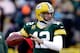 GREEN BAY, WI - JANUARY 05: Aaron Rodgers #12 of the Green Bay Packers looks to throw a pass during warm ups prior to their NFC Wild Card Playoff game against the San Francisco 49ers at Lambeau Field on January 5, 2014 in Green Bay, Wisconsin. (Photo by