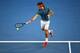 MELBOURNE, AUSTRALIA - JANUARY 22: Roger Federer of Switzerland plays a forehand in his quarterfinal match against Andy Murray of Great Britain during day 10 of the 2014 Australian Open at Melbourne Park on January 22, 2014 in Melbourne, Australia. (Pho
