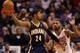PHOENIX, AZ - JANUARY 22: Paul George #24 of the Indiana Pacers looks to pass guarded by Marcus Morris #15 of the Phoenix Suns during the second half of the NBA game at US Airways Center on January 22, 2014 in Phoenix, Arizona. The Suns defeated the Pac
