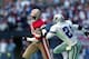 12 Nov 1995: Jerry Rice #80 of the San Francisco 49ers runs with the ball as Deion Sanders #21 of the Dallas Cowboys runs after him during the game at the Texas Stadium in Irving, Texas. The 49ers defeated the Cowboys 38-20.
