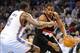 Jan 21, 2014; Oklahoma City, OK, USA; Portland Trail Blazers power forward LaMarcus Aldridge (12) handles the ball against Oklahoma City Thunder center Kendrick Perkins (5) during the first quarter at Chesapeake Energy Arena. Mandatory Credit: Mark D. Smi