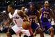 Jan 19, 2014; Toronto, Ontario, CAN; Toronto Raptors guard Kyle Lowry (7) controls the ball against Los Angeles Lakers forward-center Jordan Hill (27) and center Robert Sacre (50) during the first half at the Air Canada Centre. Mandatory Credit: John E. S