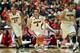TUCSON, AZ - JANUARY 23: T.J. McConnell #4 of the Arizona Wildcats moves the ball upcourt alongside Brandon Ashley #21 (L) and Gabe York #1 (R) during the first half of the college basketball game against the Colorado Buffaloes at McKale Center on Januar