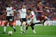 LONDON, ENGLAND - MAY 28: Luis Antonio Valencia of Manchester United (L) and teammate Fabio da Silva (C) look on as Lionel Messi of FC Barcelona (R) takes a shot during the UEFA Champions League final between FC Barcelona and Manchester United FC at Wem