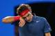 MELBOURNE, AUSTRALIA - JANUARY 24: Roger Federer of Switzerland wipes his face in his semifinal match against Rafael Nadal of Spain during day 12 of the 2014 Australian Open at Melbourne Park on January 24, 2014 in Melbourne, Australia. (Photo by Mark K