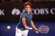MELBOURNE, AUSTRALIA - JANUARY 24: Roger Federer of Switzerland plays a backhand in his semifinal match against Rafael Nadal of Spain during day 12 of the 2014 Australian Open at Melbourne Park on January 24, 2014 in Melbourne, Australia. (Photo by Matt
