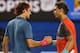 MELBOURNE, AUSTRALIA - JANUARY 24: Rafael Nadal of Spain shakes hands with Roger Federer of Switzerland after Nadal won their semifinal match during day 12 of the 2014 Australian Open at Melbourne Park on January 24, 2014 in Melbourne, Australia. (Photo