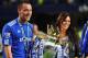 LONDON, ENGLAND - MAY 09: John Terry of Chelsea celebrates with wife Toni and his childrenas they win the title after the Barclays Premier League match between Chelsea and Wigan Athletic at Stamford Bridge on May 9, 2010 in London, England. Chelsea won 8