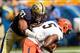 Sep 28, 2013; Pittsburgh, PA, USA; Pittsburgh Panthers defensive lineman Aaron Donald (97) sacks Virginia Cavaliers quarterback David Watford (5) during the second quarter at Heinz Field. Mandatory Credit: Howard Smith-USA TODAY Sports