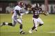 Nov 16, 2013; Starkville, MS, USA; Mississippi State Bulldogs running back LaDarius Perkins (27) advances the ball and stiff arms Alabama Crimson Tide linebacker C.J. Mosley (32) during the game at Davis Wade Stadium. Alabama Crimson Tide defeat the Missi